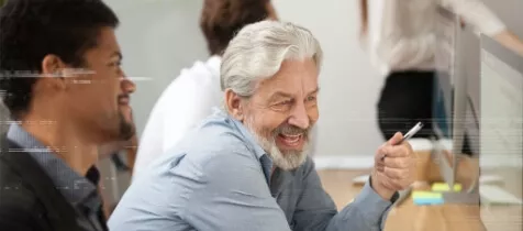 An elderly gentleman making his point with a smile